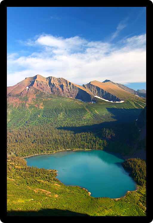 Grinnell Lake amidst the majestic mountain scenery of Glacier National Park in Montana.