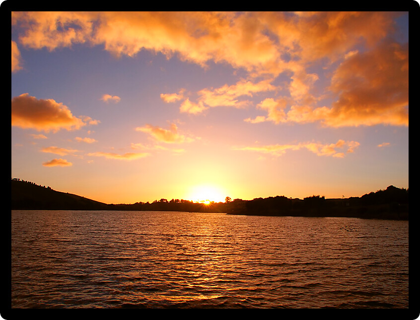 Sunset over small waves on the Hopkins River near Warrnambool of Victoria Australia.
