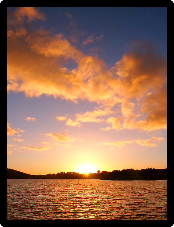 Sunset over small waves on the Hopkins River near Warrnambool of Victoria Australia.