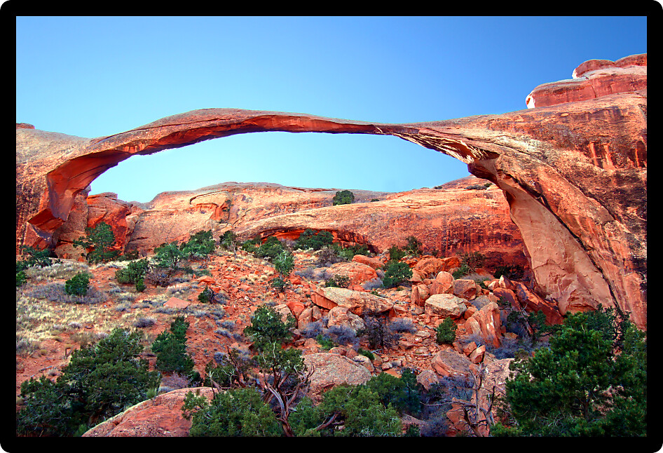 Landscape Arch stretches across the skyline at Arches National Park in Utah.