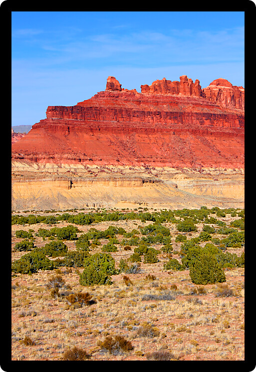 Bright red rock mountains near the Black Dragon Canyon in Utah.