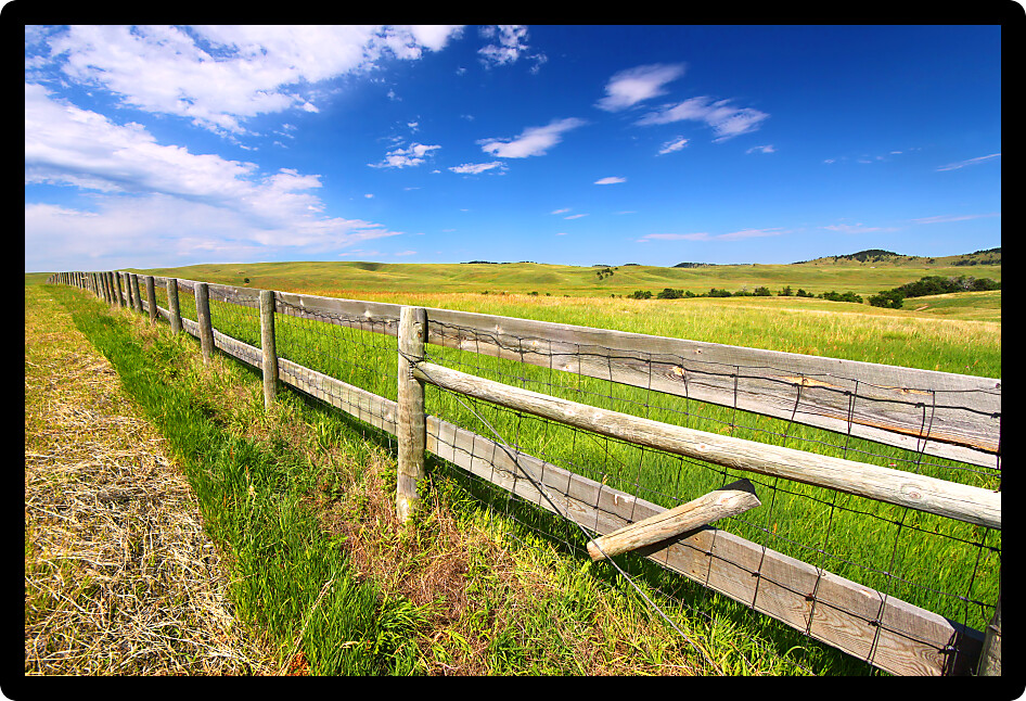 Wooden fenceline in the prairies of Custer State Park South Dakota.
