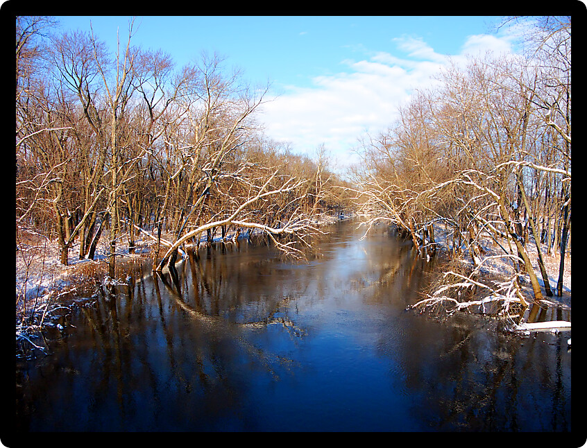 Sangamon River in central Illinois under a brilliant blue sky.