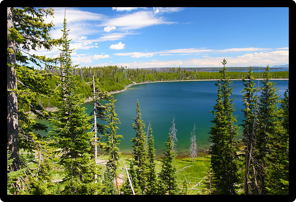 Beautiful blue waters Duck Lake in Yellowstone National Park of Wyoming.